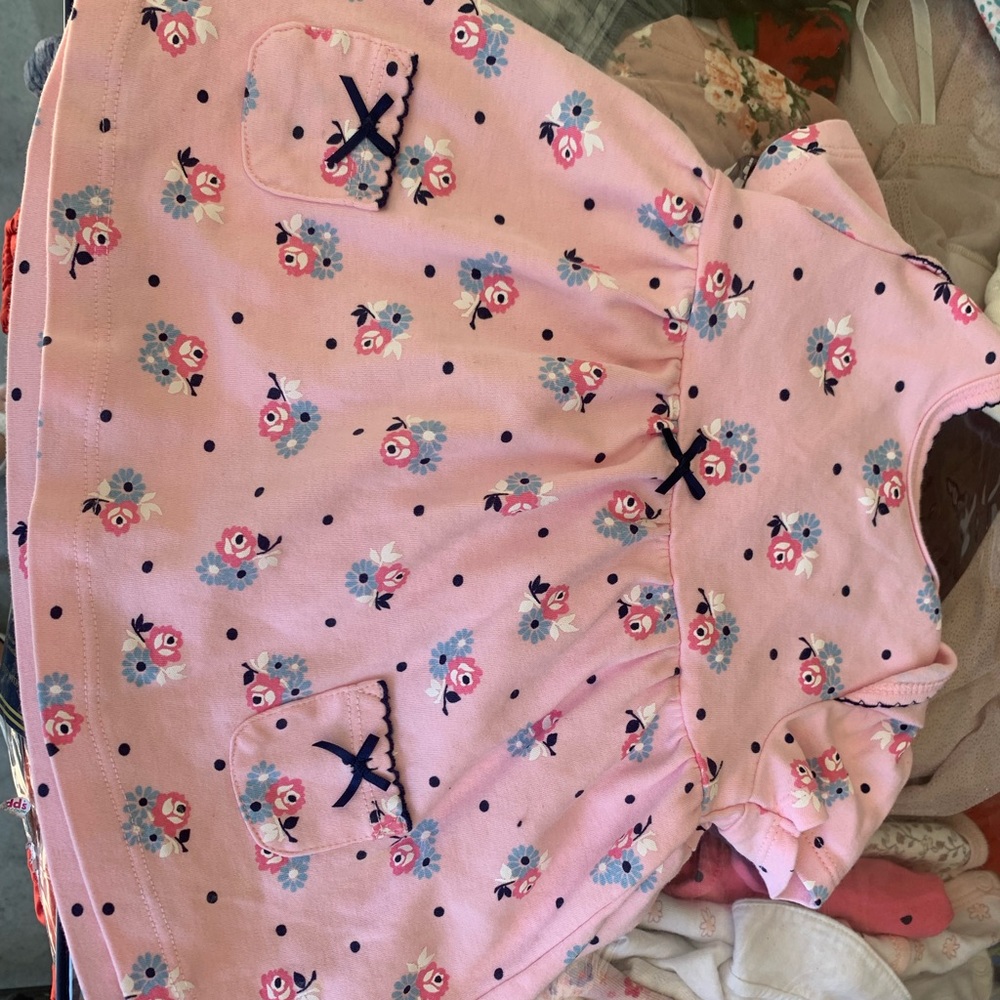Two baby shirts and three baby dresses